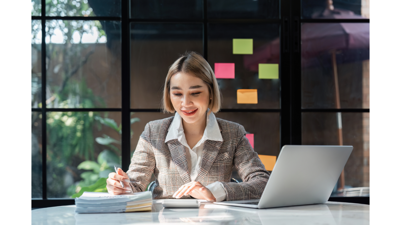 happy female employee with laptop